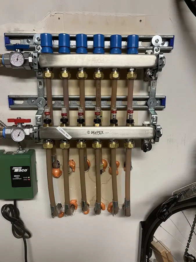 Plumber performing Water Heater Repair at a residential property in El Granada